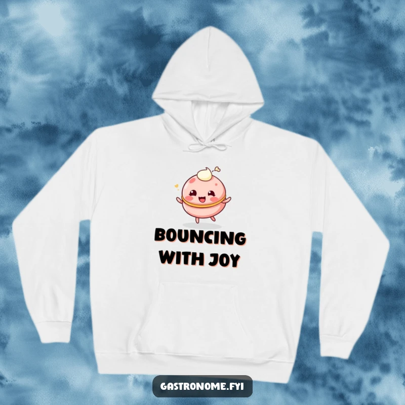 Funny hoodie featuring a giggling, bouncing macaroon character with a cream dollop, ideal for cozy humor.