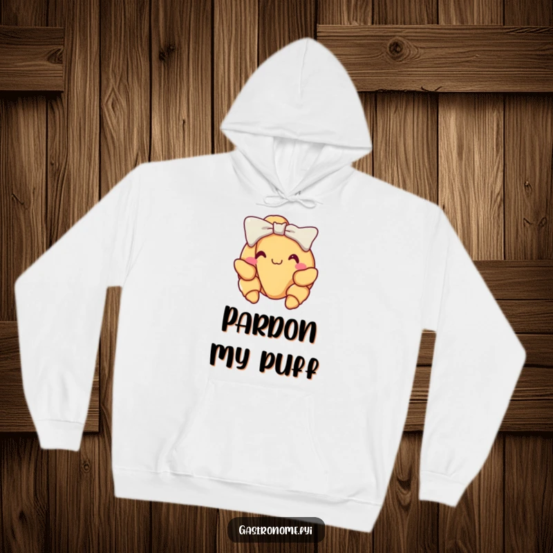 Funny croissant hoodie, smiling with pride, taking a sophisticated little bow, offering warmth and humor with a French touch.